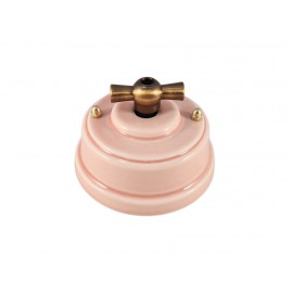 Выключатель (переключатель) фарфоровый поворотный одноклавишный проходной, цвет rosa (розовый), ручка бронза 
